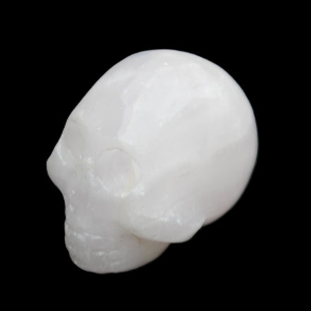 Mangano Calcite skull 30*42*35mm 77g in sunlight - Rocks and Things Store