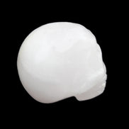 Mangano Calcite skull 30*42*35mm 77g in sunlight - Rocks and Things Store
