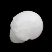 Mangano Calcite skull 30*42*35mm 77g in sunlight - Rocks and Things Store