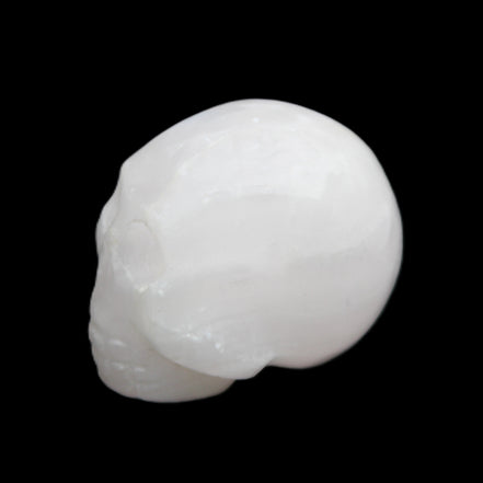Mangano Calcite skull 30*42*35mm 77g in sunlight - Rocks and Things Store
