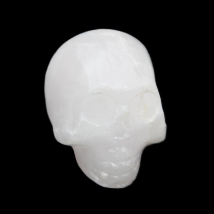 Mangano Calcite skull 30*42*35mm 77g in sunlight - Rocks and Things Store