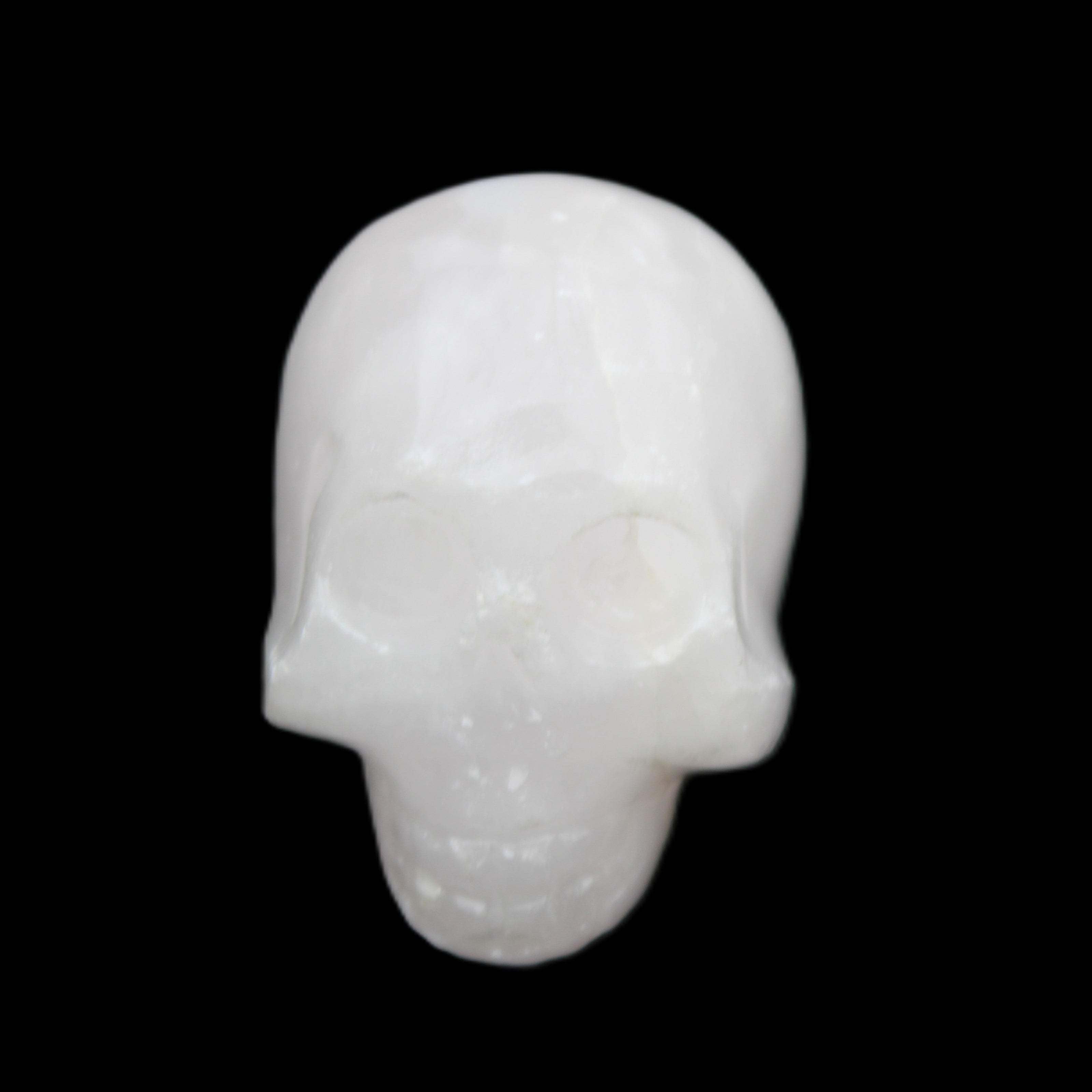 Mangano Calcite skull 30*42*35mm 77g in sunlight - Rocks and Things Store