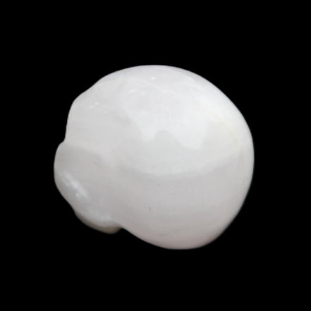 Mangano Calcite skull 30*42*35mm 77g in sunlight - Rocks and Things Store