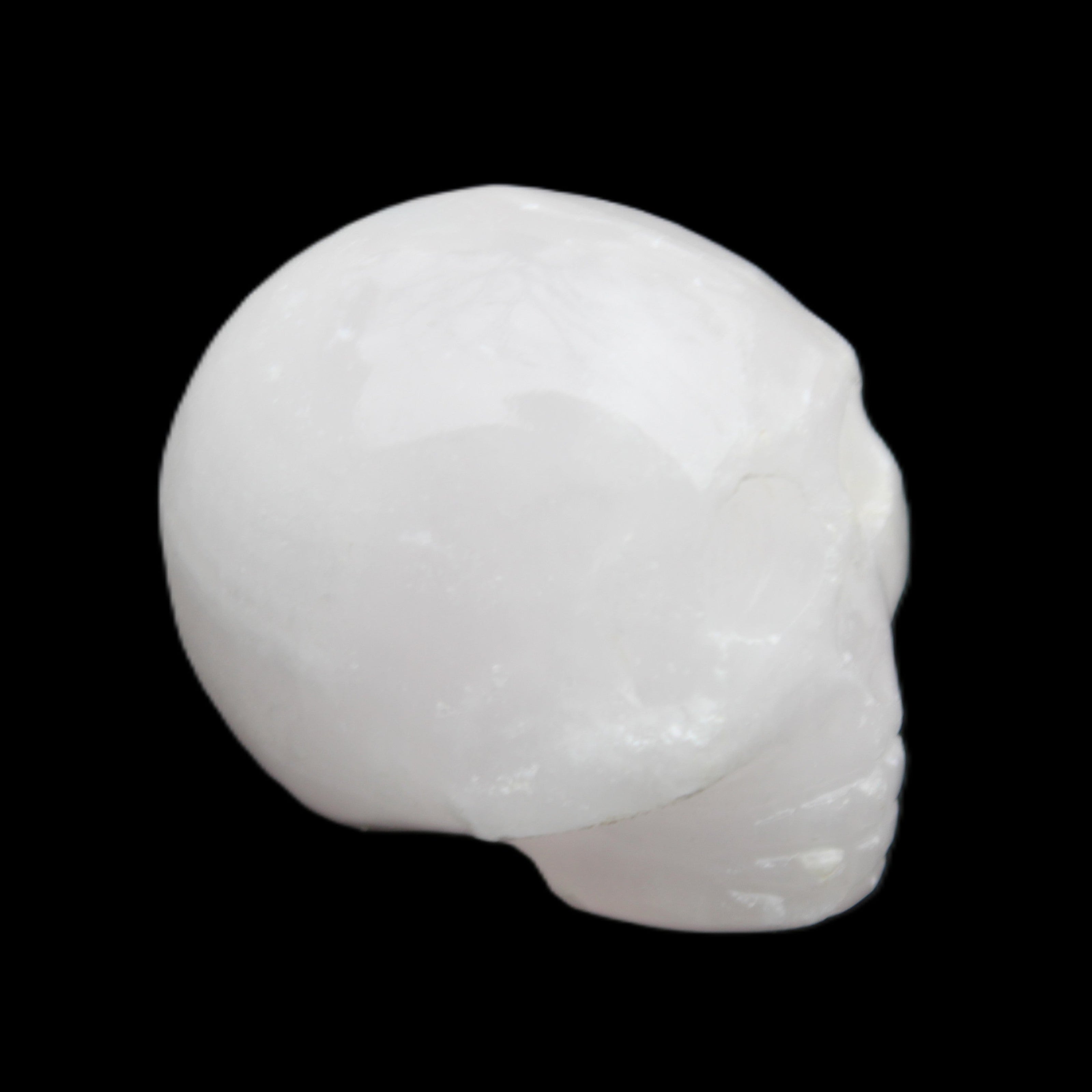 Mangano Calcite skull 30*42*35mm 77g in sunlight - Rocks and Things Store