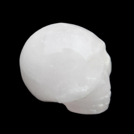 Mangano Calcite skull 30*42*35mm 77g in sunlight - Rocks and Things Store