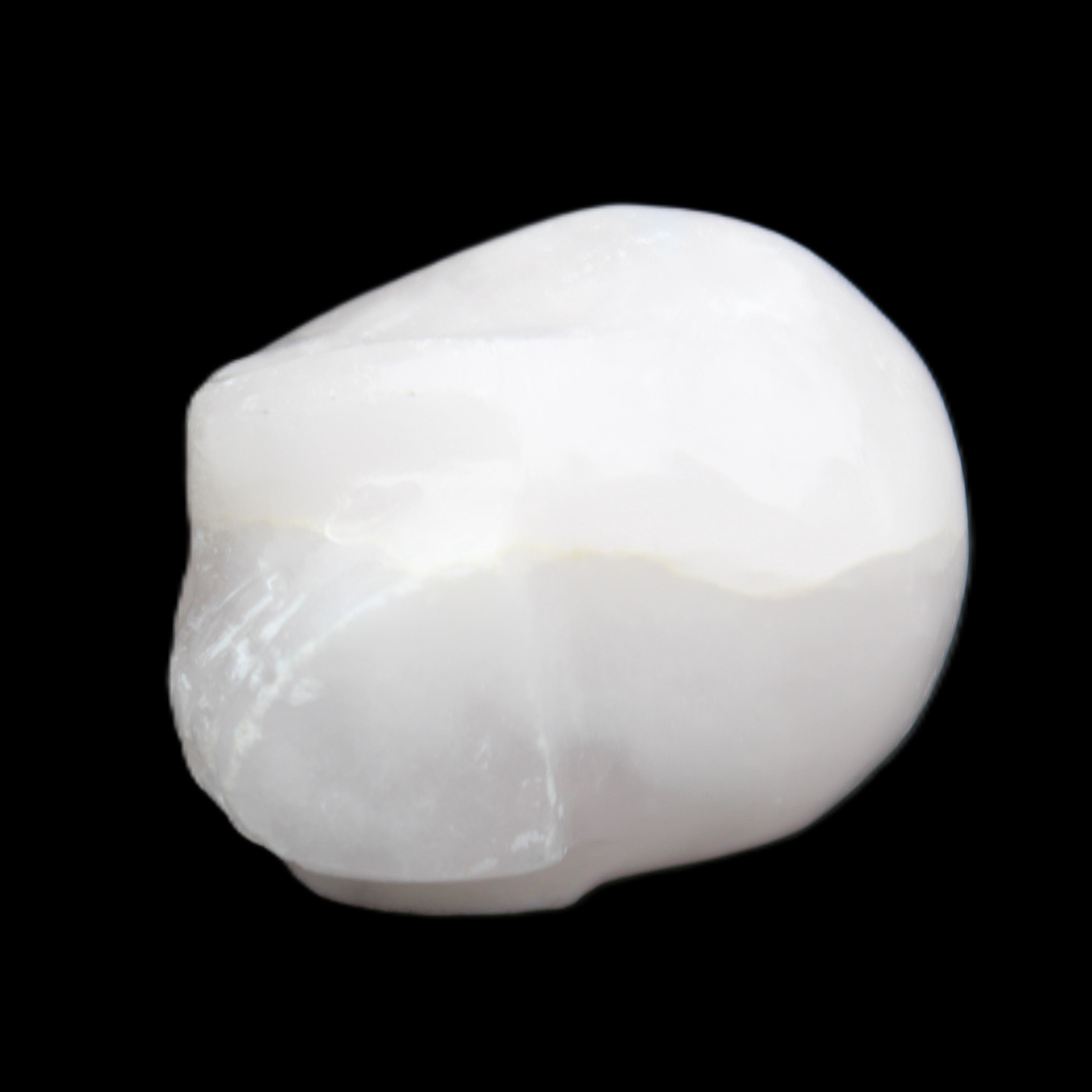 Mangano Calcite skull 30*42*35mm 77g in sunlight - Rocks and Things Store