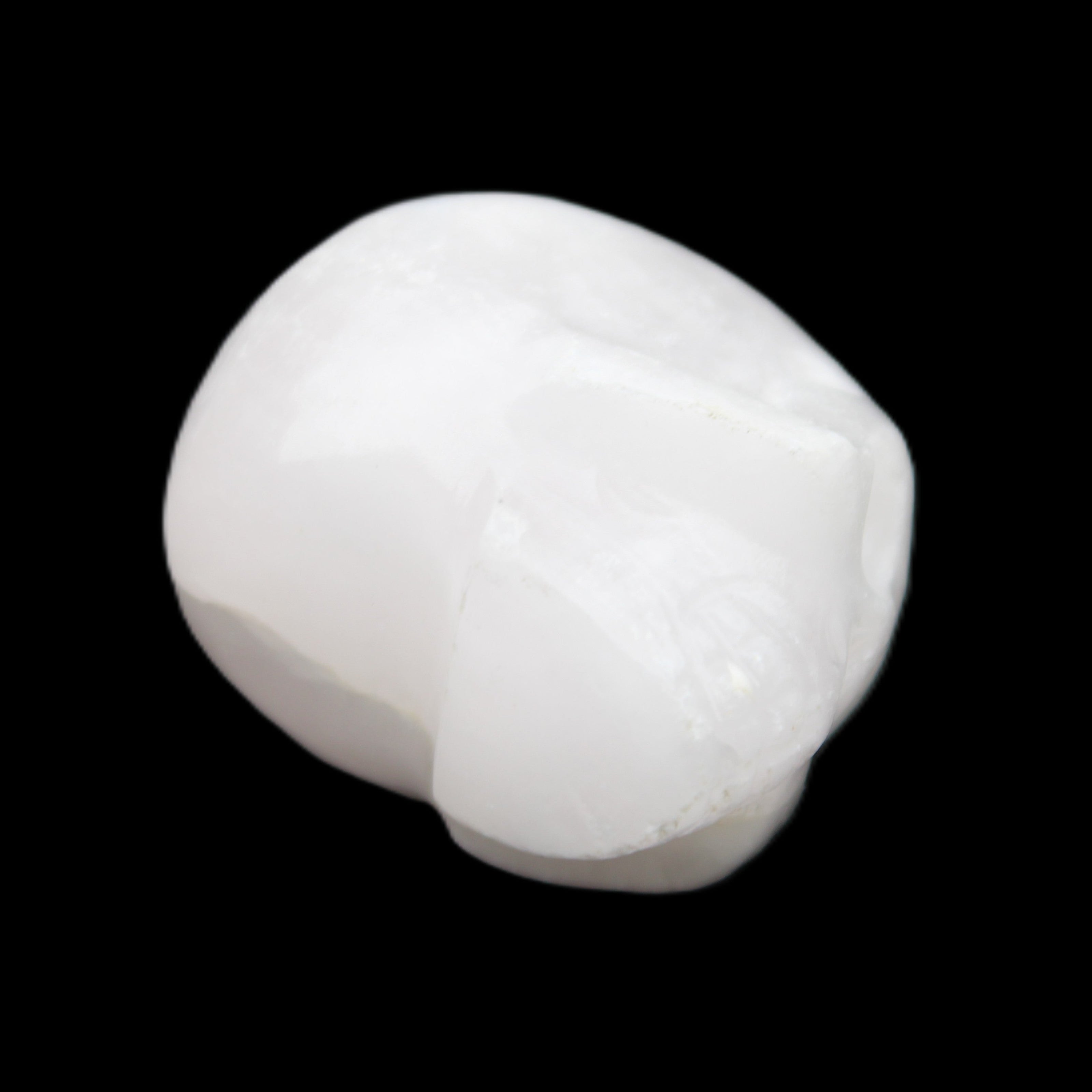 Mangano Calcite skull 30*42*35mm 77g in sunlight - Rocks and Things Store
