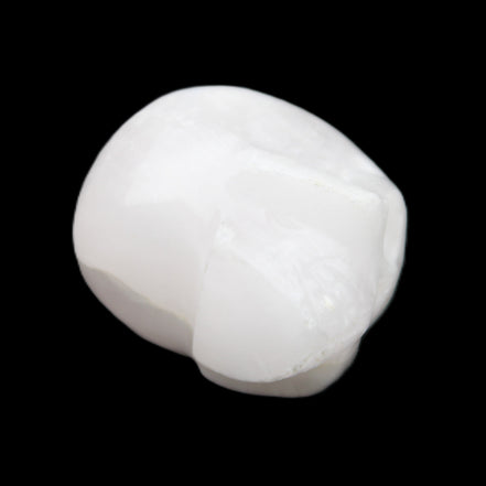 Mangano Calcite skull 30*42*35mm 77g in sunlight - Rocks and Things Store