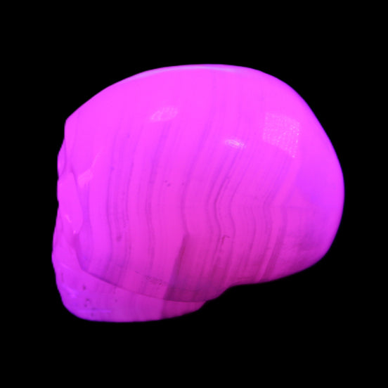 Mangano Calcite skull 30*47*36mm 85g in UV light - Rocks and Things Store