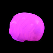 Mangano Calcite skull 30*47*36mm 85g in UV light - Rocks and Things Store