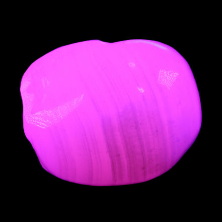 Mangano Calcite skull 30*47*36mm 85g in UV light - Rocks and Things Store