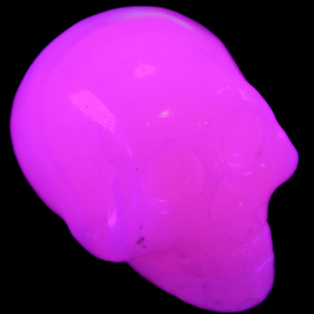 Mangano Calcite skull 30*47*36mm 85g in UV light - Rocks and Things Store