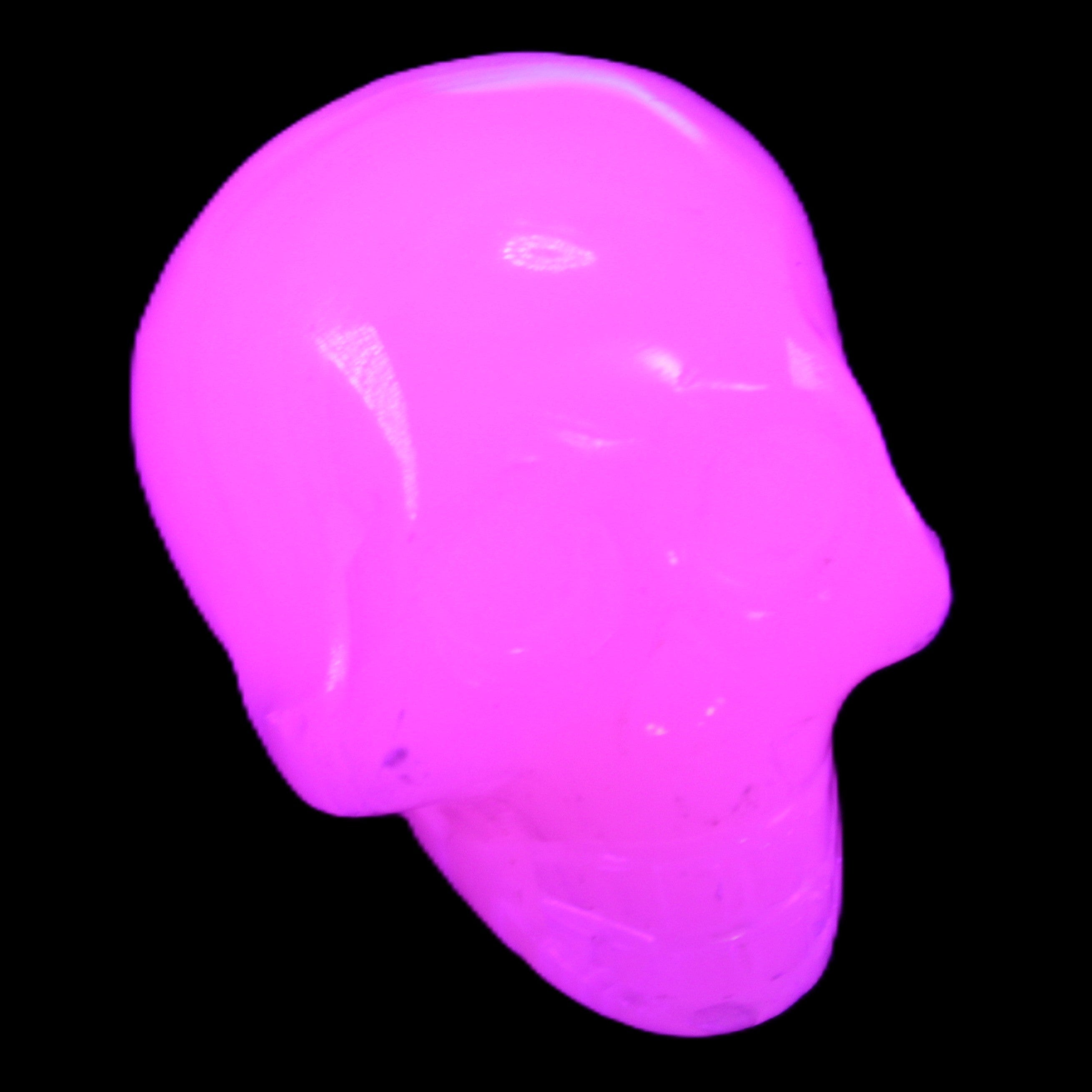 Mangano Calcite skull 30*47*36mm 85g in UV light - Rocks and Things Store