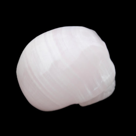 Mangano Calcite skull 30*47*36mm 85g in sunlight - Rocks and Things Store