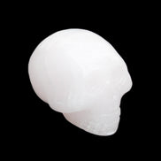 Mangano Calcite skull 30*47*36mm 85g in sunlight - Rocks and Things Store