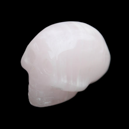 Mangano Calcite skull 30*47*36mm 85g in sunlight - Rocks and Things Store