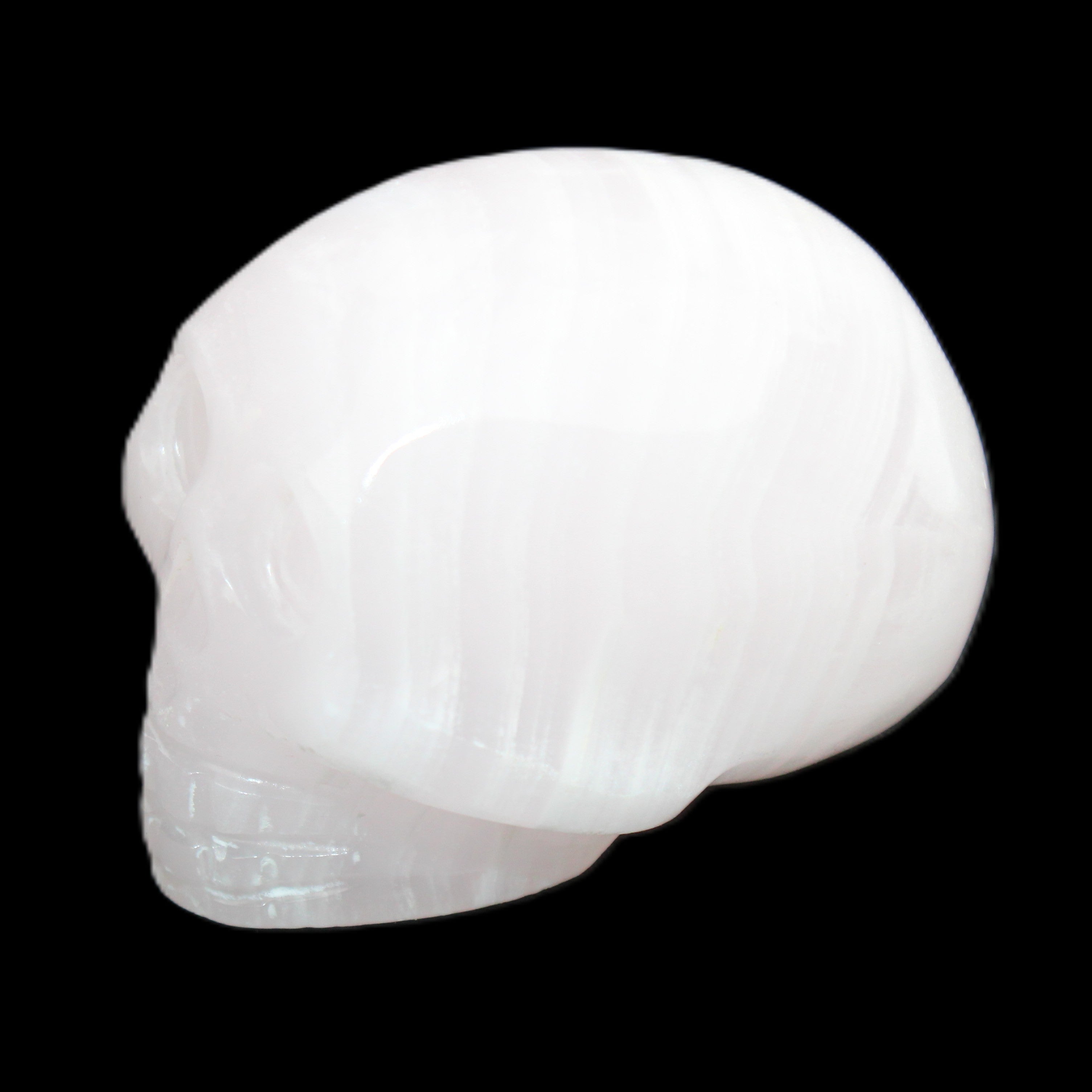 Mangano Calcite skull 30*47*36mm 85g in sunlight - Rocks and Things Store