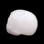 Mangano Calcite skull 30*47*36mm 85g in sunlight - Rocks and Things Store