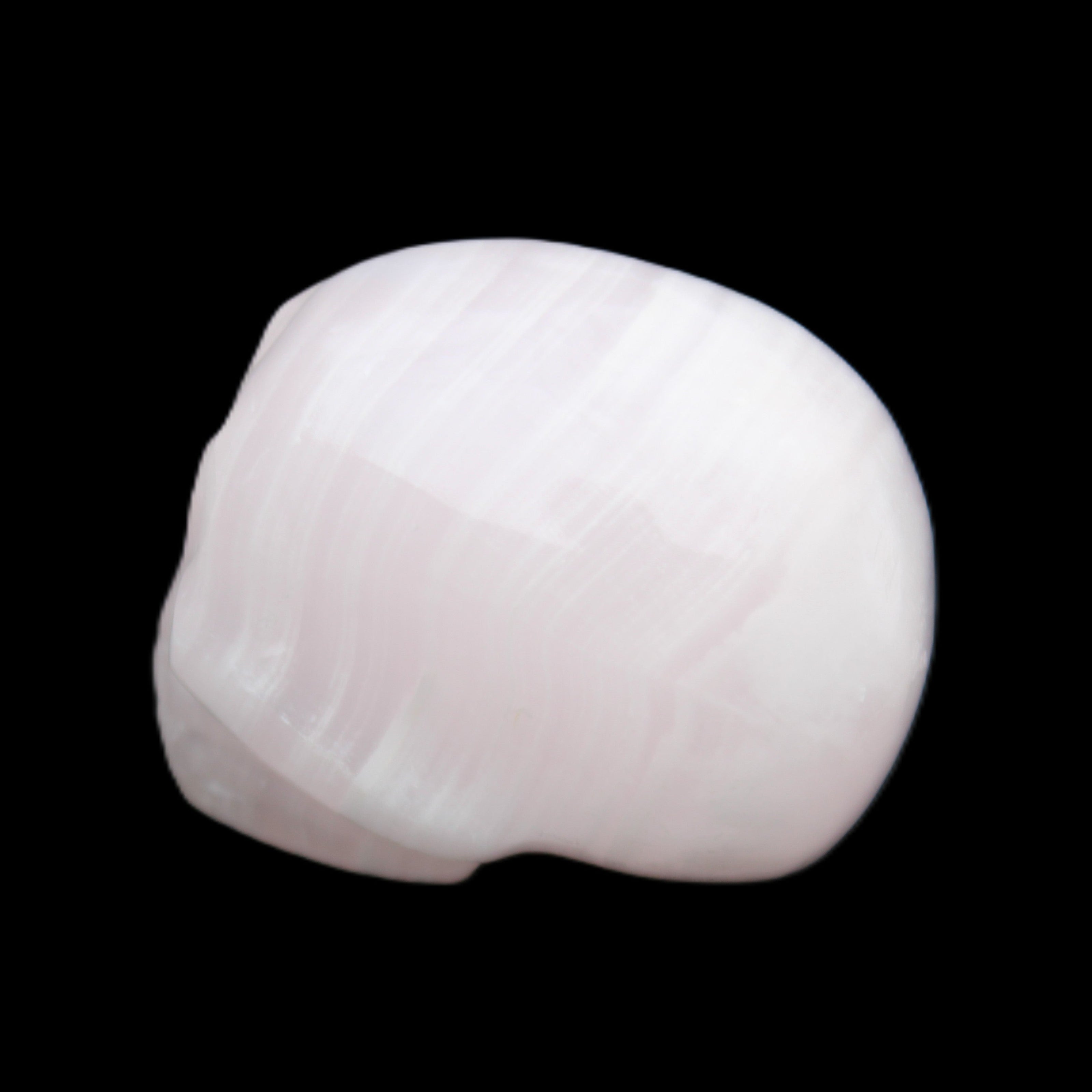 Mangano Calcite skull 30*47*36mm 85g in sunlight - Rocks and Things Store