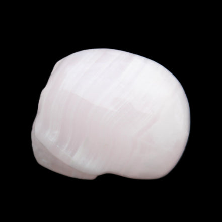 Mangano Calcite skull 30*47*36mm 85g in sunlight - Rocks and Things Store