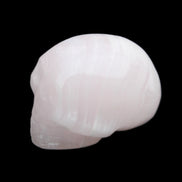 Mangano Calcite skull 30*47*36mm 85g in sunlight - Rocks and Things Store