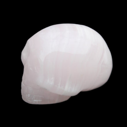 Mangano Calcite skull 30*47*36mm 85g in sunlight - Rocks and Things Store