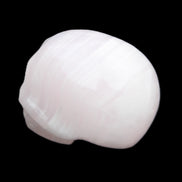 Mangano Calcite skull 30*47*36mm 85g in sunlight - Rocks and Things Store