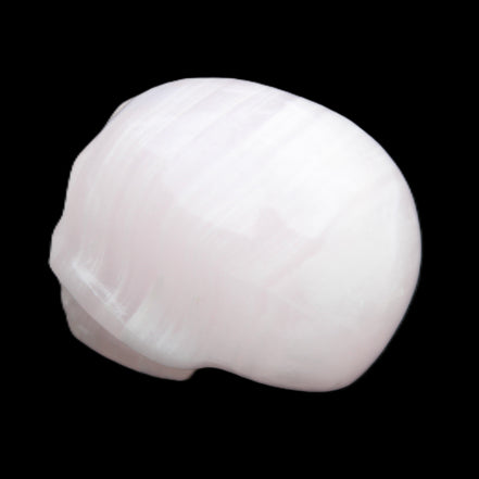 Mangano Calcite skull 30*47*36mm 85g in sunlight - Rocks and Things Store