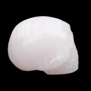 Mangano Calcite skull 30*47*36mm 85g in sunlight - Rocks and Things Store