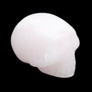 Mangano Calcite skull 30*47*36mm 85g in sunlight - Rocks and Things Store