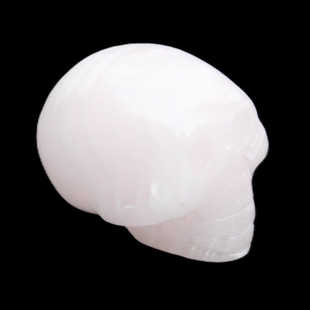 Mangano Calcite skull 30*47*36mm 85g in sunlight - Rocks and Things Store