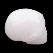 Mangano Calcite skull 30*47*36mm 85g in sunlight - Rocks and Things Store