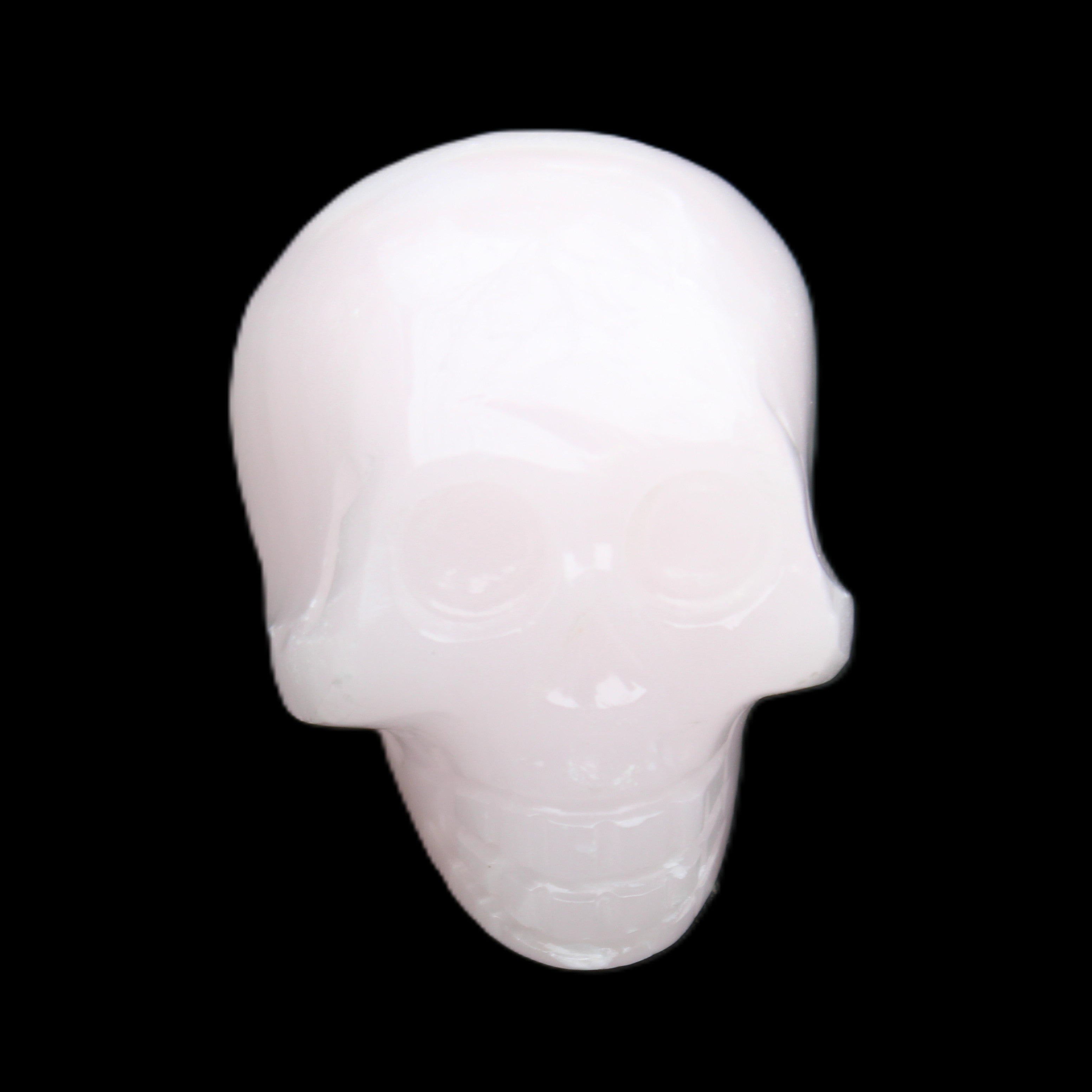 Mangano Calcite skull 30*47*36mm 85g in sunlight - Rocks and Things Store