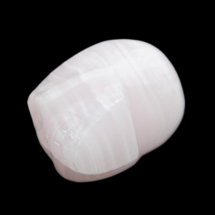 Mangano Calcite skull 30*47*36mm 85g in sunlight - Rocks and Things Store