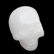 Mangano Calcite skull 30*47*36mm 85g in sunlight - Rocks and Things Store