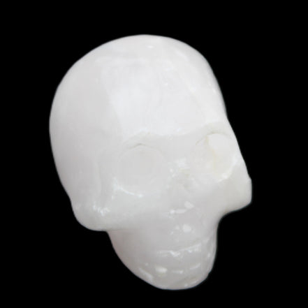 Mangano Calcite skull 30*47*36mm 85g in sunlight - Rocks and Things Store
