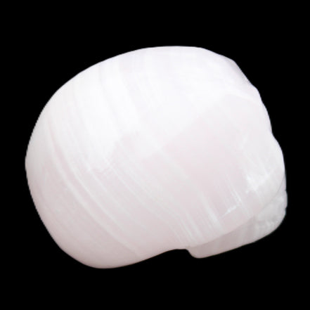Mangano Calcite skull 30*47*36mm 85g in sunlight - Rocks and Things Store