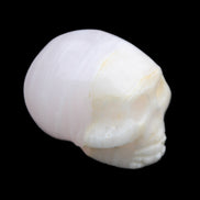Mangano Calcite skull 31*46*36mm 83g in sunlight - Rocks and Things Store