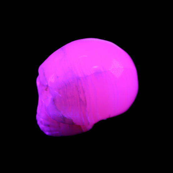 Mangano Calcite skull 31*46*36mm 83g in UV light - Rocks and Things Store