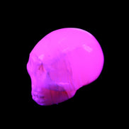 Mangano Calcite skull 31*46*36mm 83g in UV light - Rocks and Things Store
