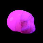 Mangano Calcite skull 31*46*36mm 83g in UV light - Rocks and Things Store