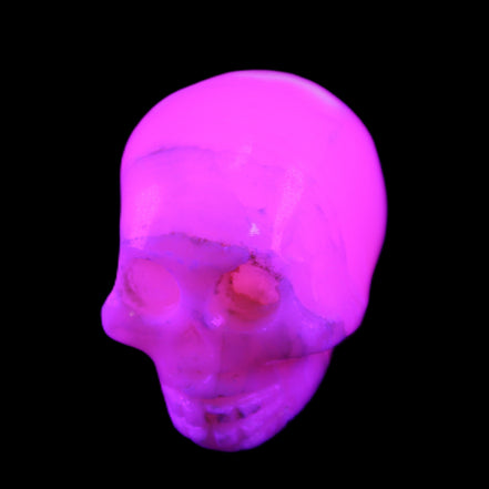 Mangano Calcite skull 31*46*36mm 83g in UV light - Rocks and Things Store