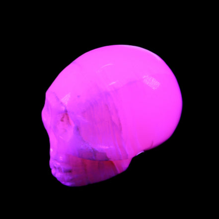 Mangano Calcite skull 31*46*36mm 83g in UV light - Rocks and Things Store