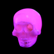 Mangano Calcite skull 31*46*36mm 83g in UV light - Rocks and Things Store