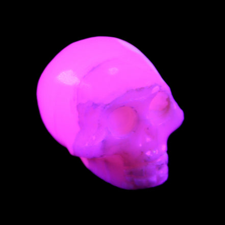 Mangano Calcite skull 31*46*36mm 83g in UV light - Rocks and Things Store