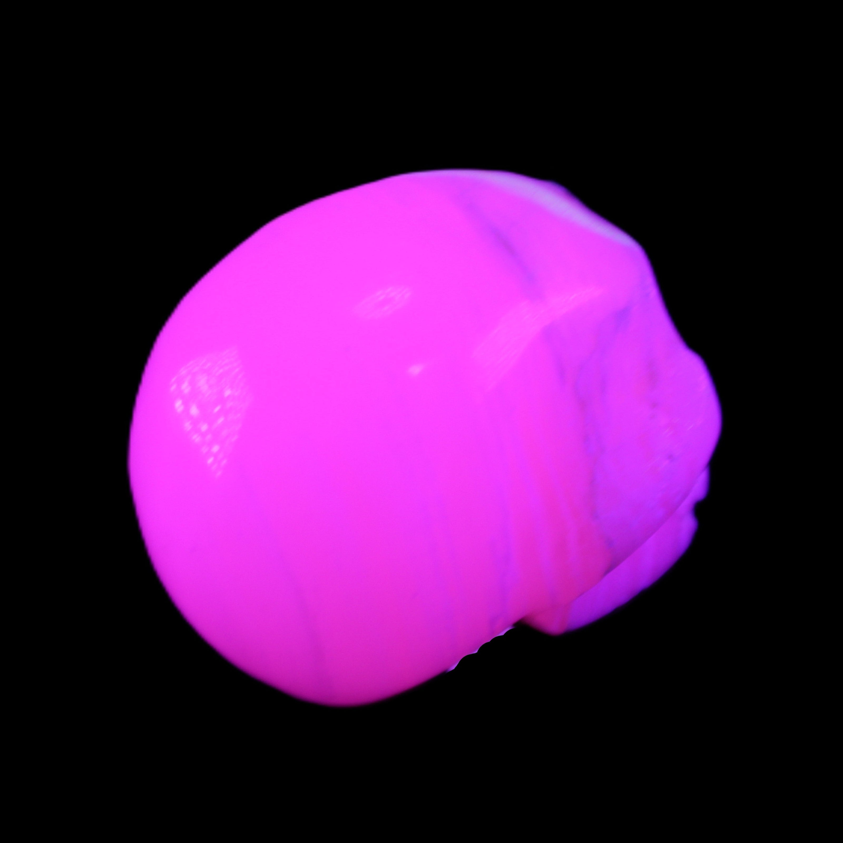 Mangano Calcite skull 31*46*36mm 83g in UV light - Rocks and Things Store