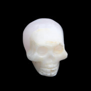 Mangano Calcite skull 31*46*36mm 83g in sunlight - Rocks and Things Store