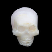 Mangano Calcite skull 31*46*36mm 83g in sunlight - Rocks and Things Store