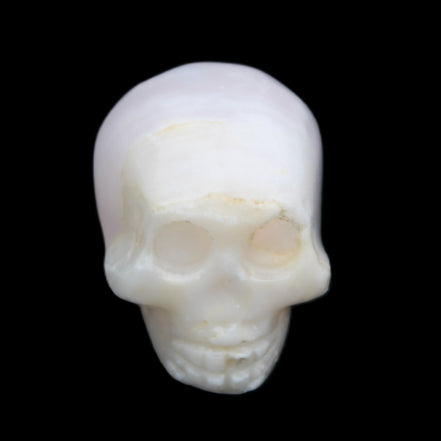 Mangano Calcite skull 31*46*36mm 83g in sunlight - Rocks and Things Store