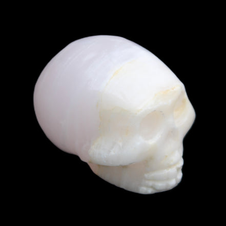 Mangano Calcite skull 31*46*36mm 83g in sunlight - Rocks and Things Store